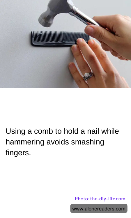 Using a comb to hold a nail while hammering avoids smashing fingers.